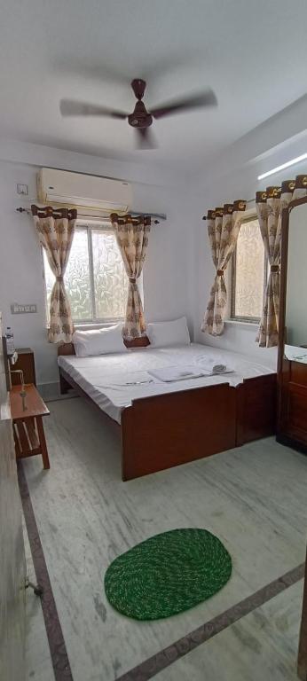 Postel nebo postele na pokoji v ubytování Regencyy Guest House