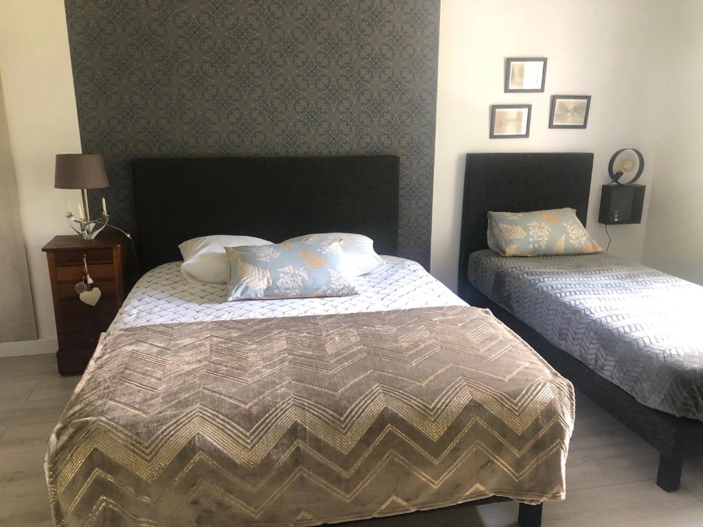 Postel nebo postele na pokoji v ubytování Chambre d'Hôtes Les Bacquerins