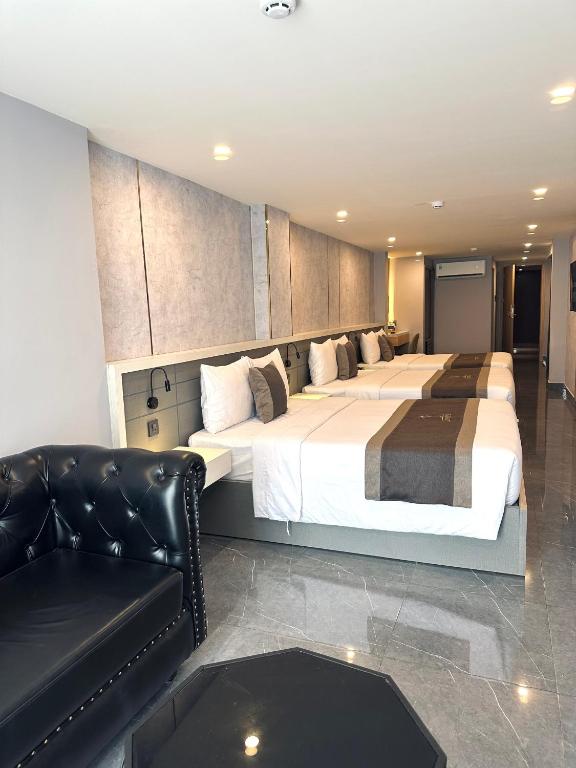 Postel nebo postele na pokoji v ubytování LION 9 HOTEL