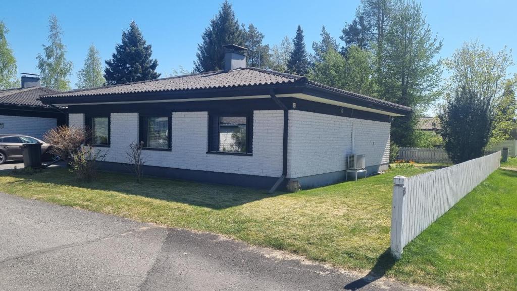 a small house with a fence in front of it at 3 bedrooms, sauna and kitchen All house in Pori