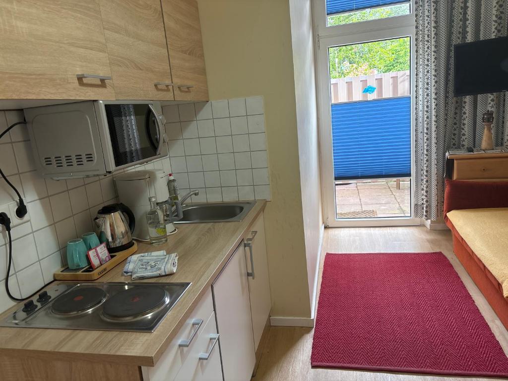 Kuchyň nebo kuchyňský kout v ubytování Haus Seemannstreu