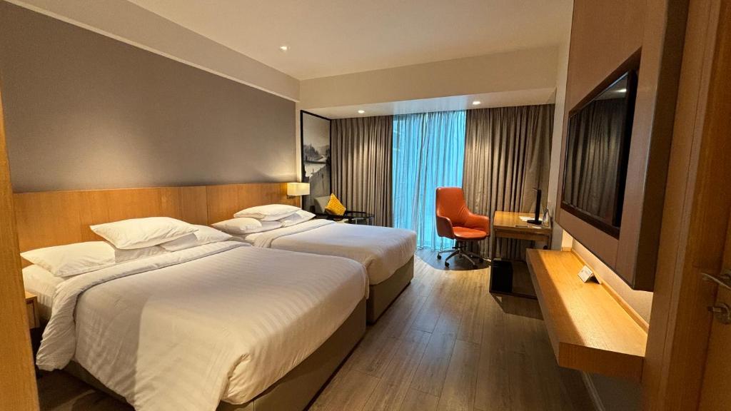 TV a/nebo společenská místnost v ubytování Courtyard by Marriott Nashik
