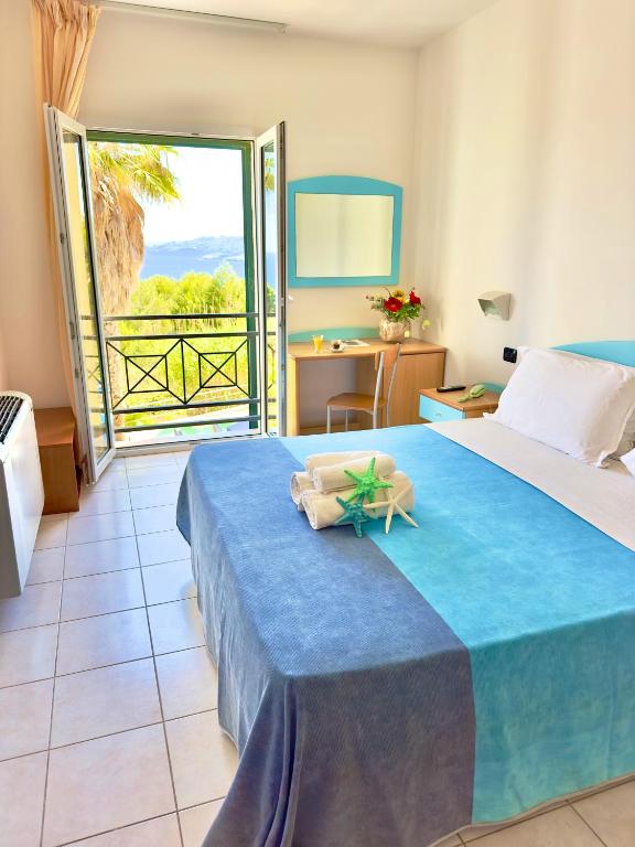 Postel nebo postele na pokoji v ubytování Hotel Alizé