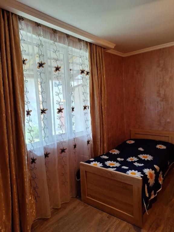 Postel nebo postele na pokoji v ubytování Guest House Gvidani