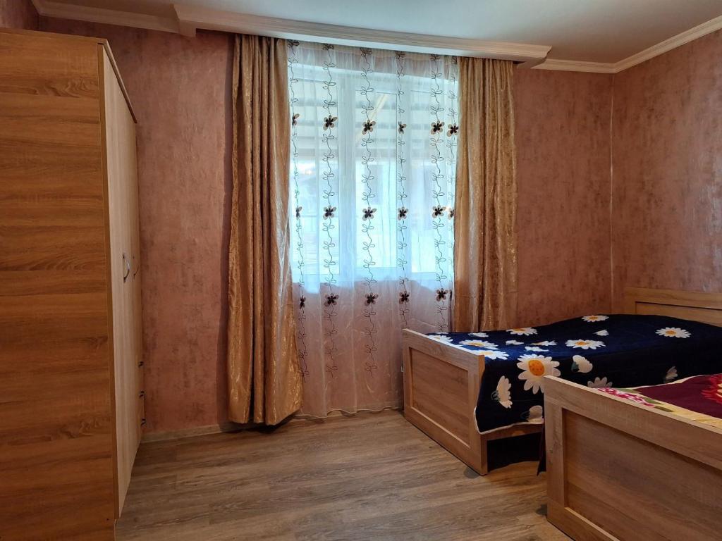 Postel nebo postele na pokoji v ubytování Guest House Gvidani
