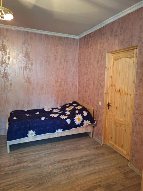 Postel nebo postele na pokoji v ubytování Guest House Gvidani