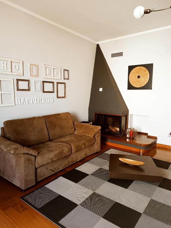 A seating area at Appartamento Incantevole La Coccola