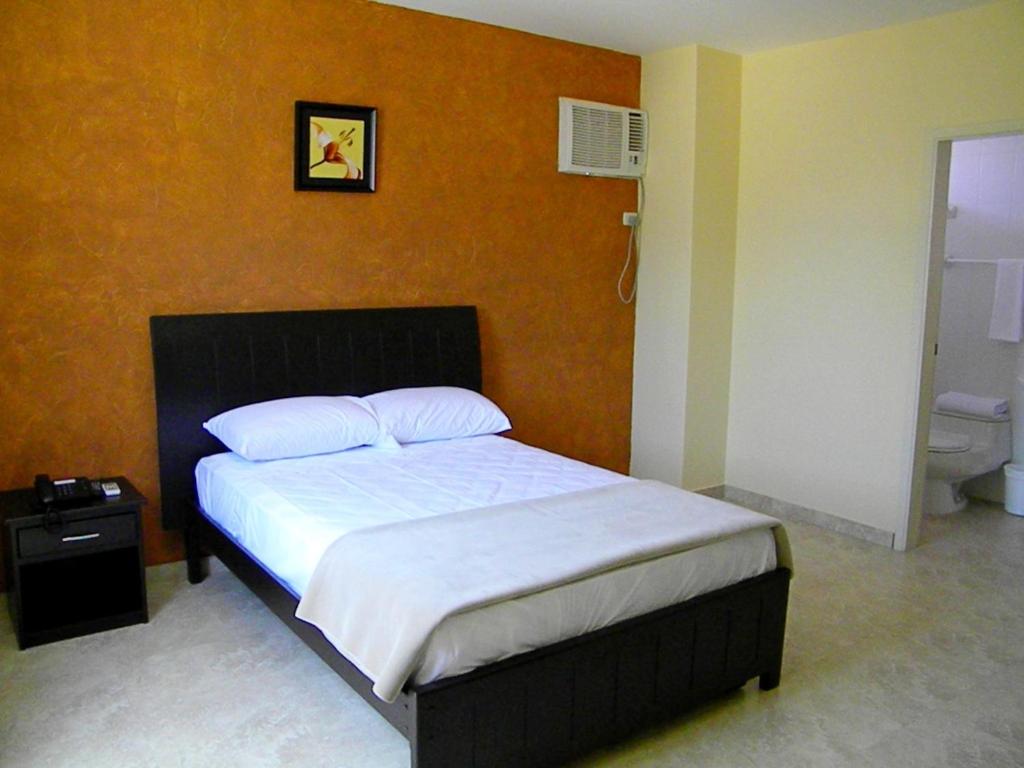 Postel nebo postele na pokoji v ubytování Hotel Marvento II