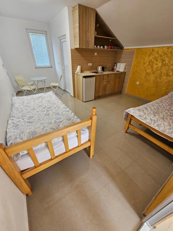 Postel nebo postele na pokoji v ubytování Apartmani Vila Ebra