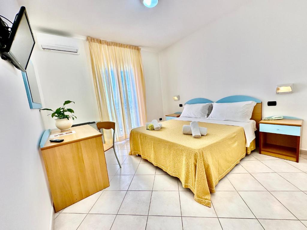 Postel nebo postele na pokoji v ubytování Hotel Alizé