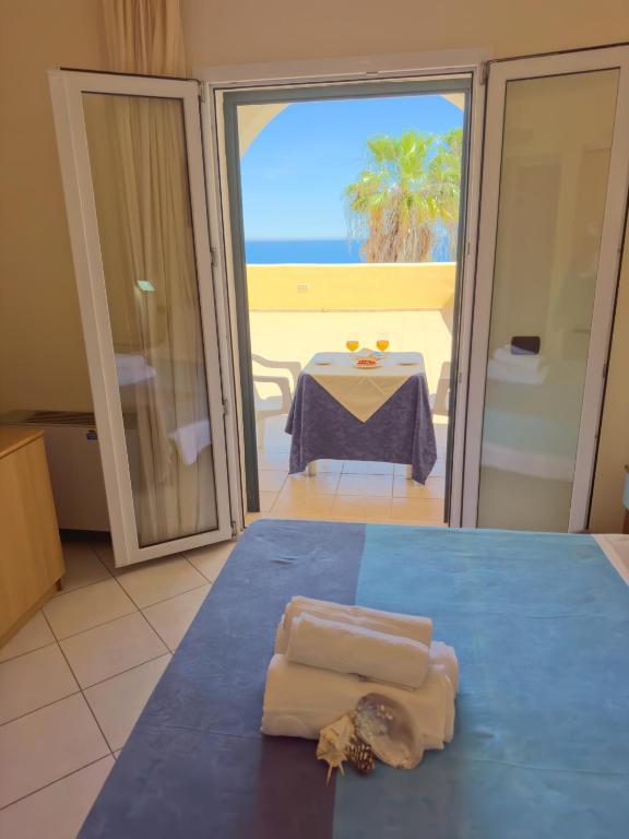 Postel nebo postele na pokoji v ubytování Hotel Alizé
