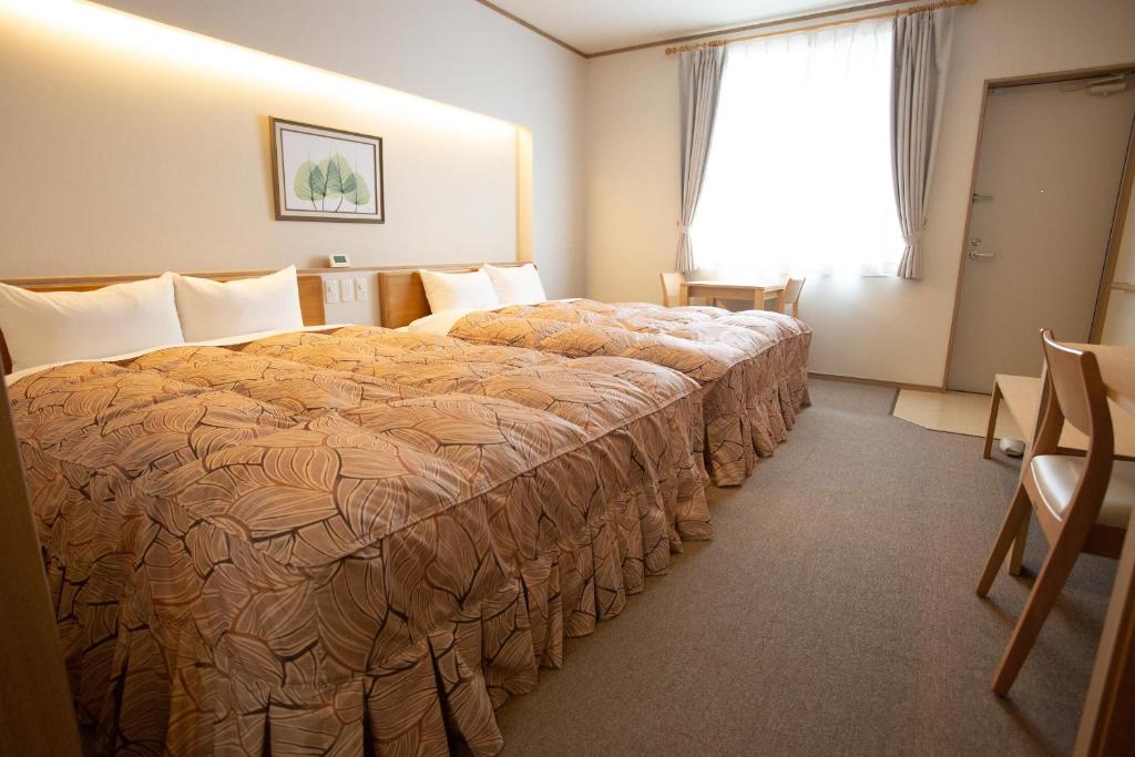 Postel nebo postele na pokoji v ubytování Family Stay Tsukuba Room