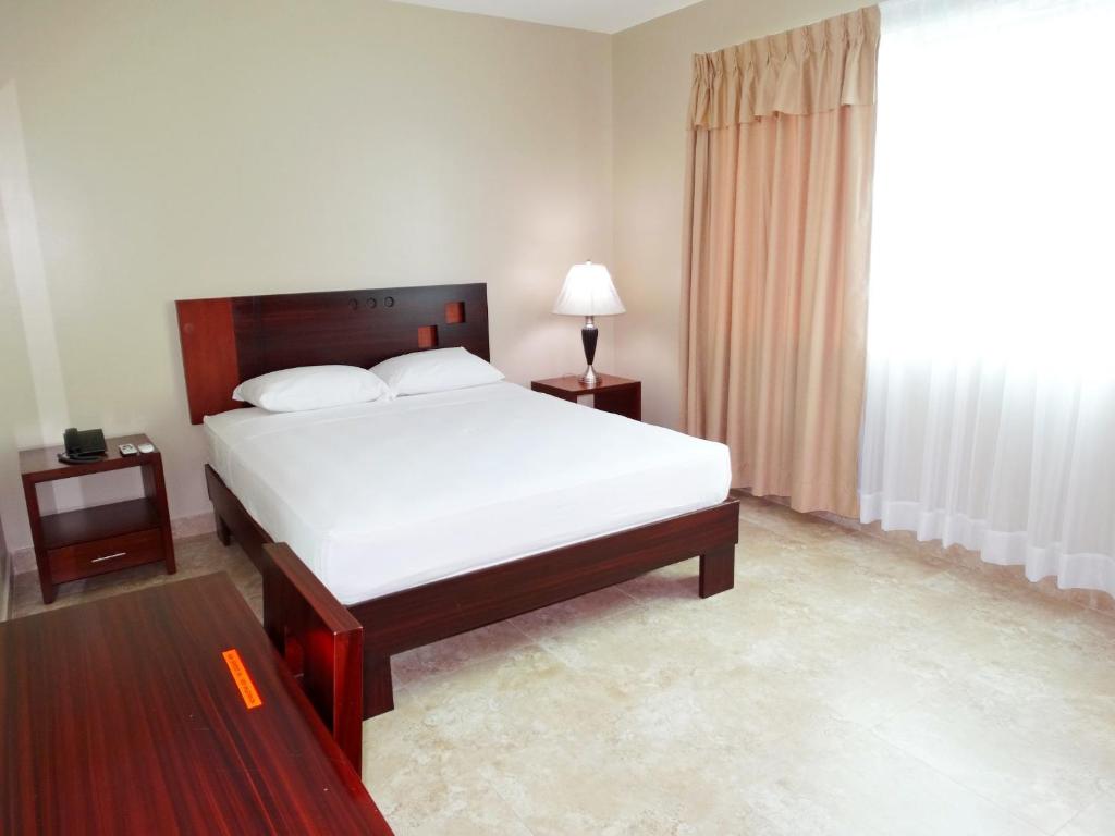 Postel nebo postele na pokoji v ubytování Hotel Marvento Suites