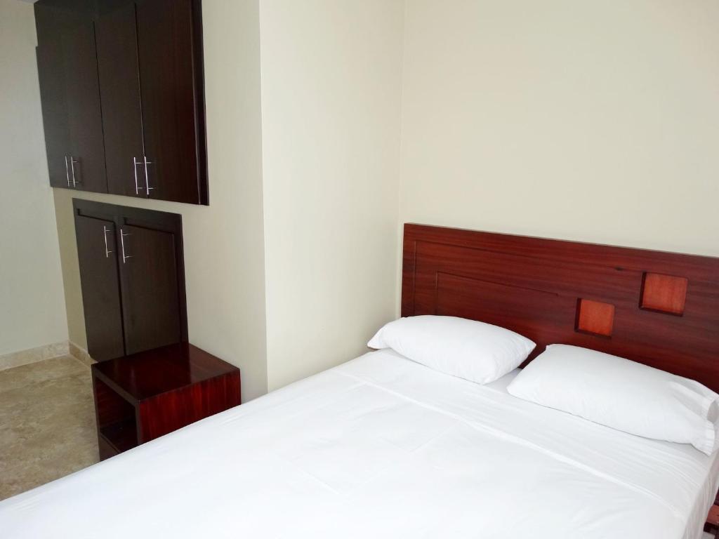 Postel nebo postele na pokoji v ubytování Hotel Marvento Suites