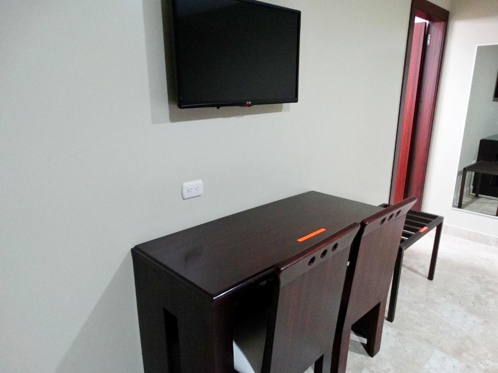 TV a/nebo společenská místnost v ubytování Hotel Marvento Suites