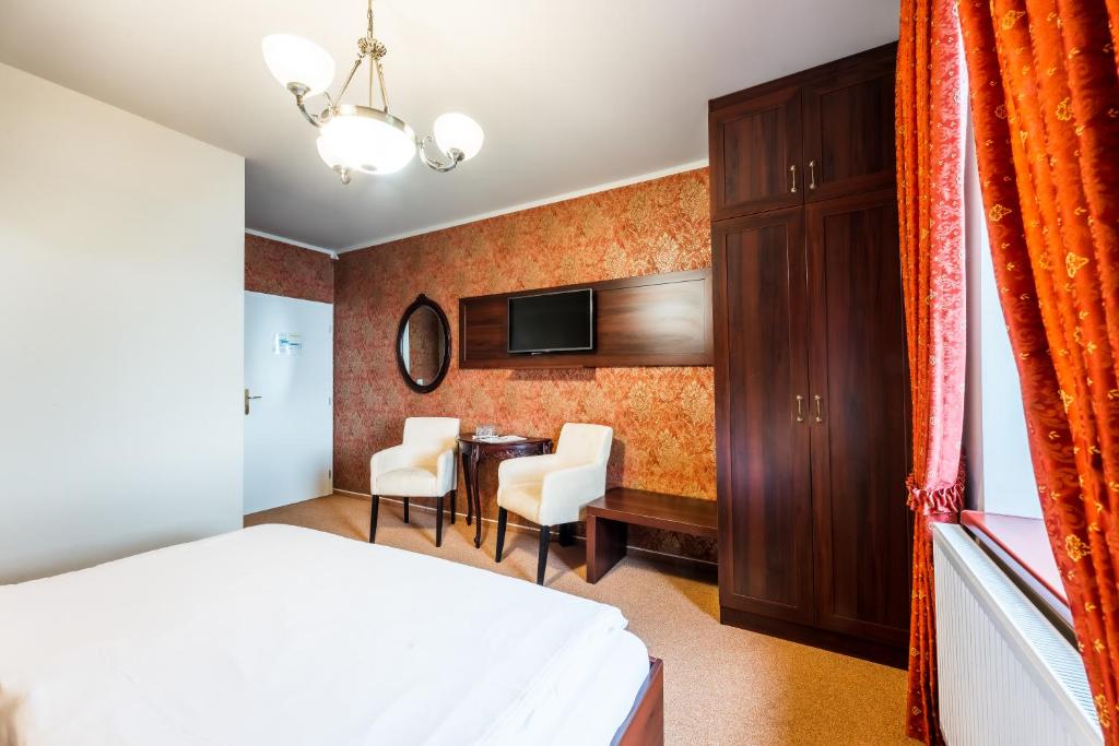 Postel nebo postele na pokoji v ubytování Hotel Plumlov