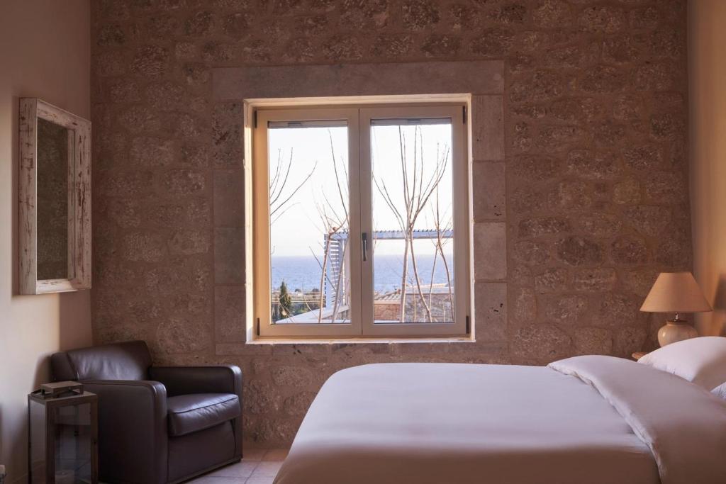 Postel nebo postele na pokoji v ubytování Riglia Villas