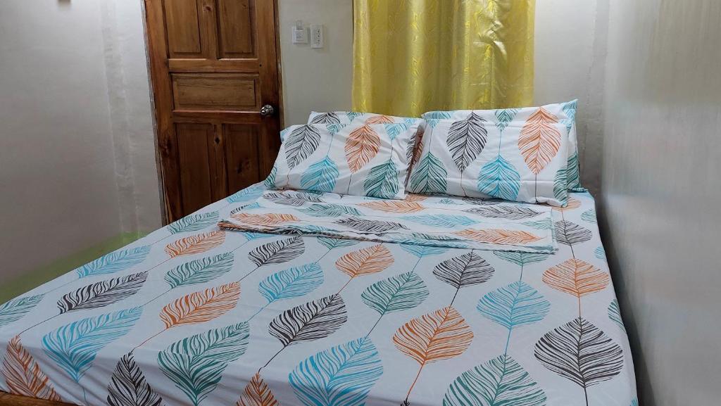 Postel nebo postele na pokoji v ubytování Mariden Resort & Homestay Siargao