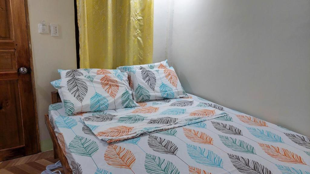 Postel nebo postele na pokoji v ubytování Mariden Resort & Homestay Siargao
