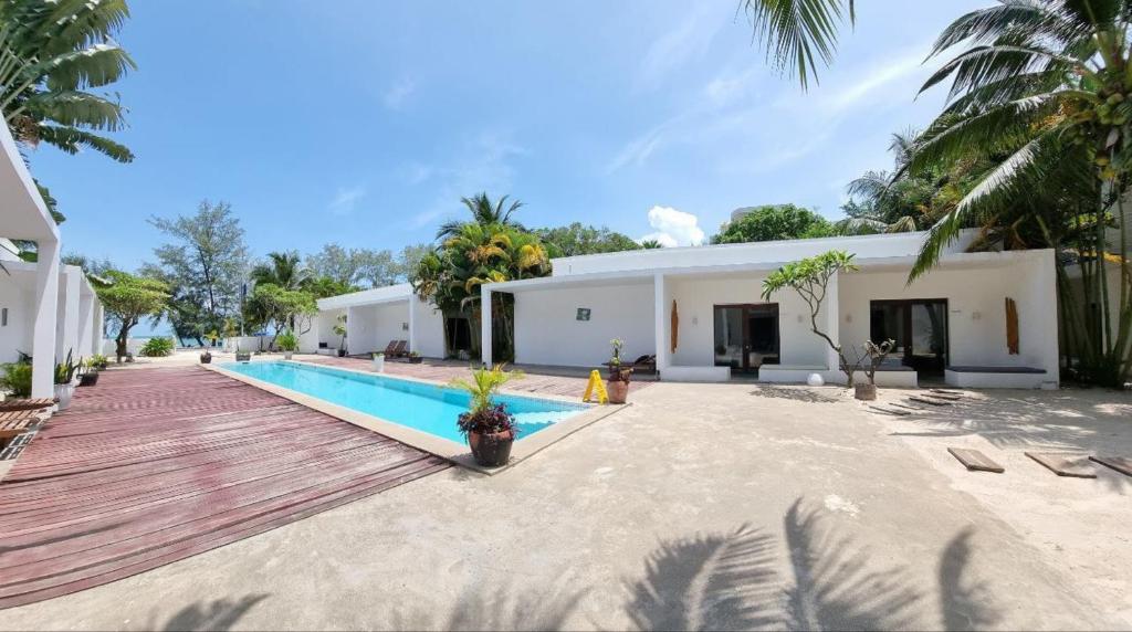 an image of a villa with a swimming pool at Mittali Beach Hotel in Sihanoukville