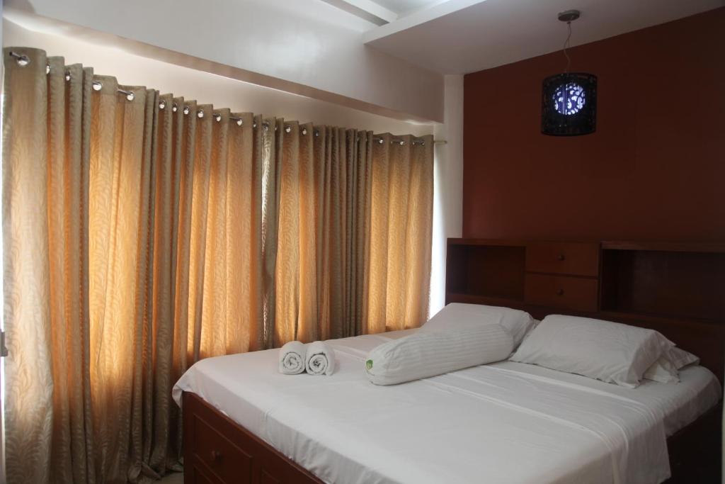 Postel nebo postele na pokoji v ubytování Green Monkey Resort Boracay