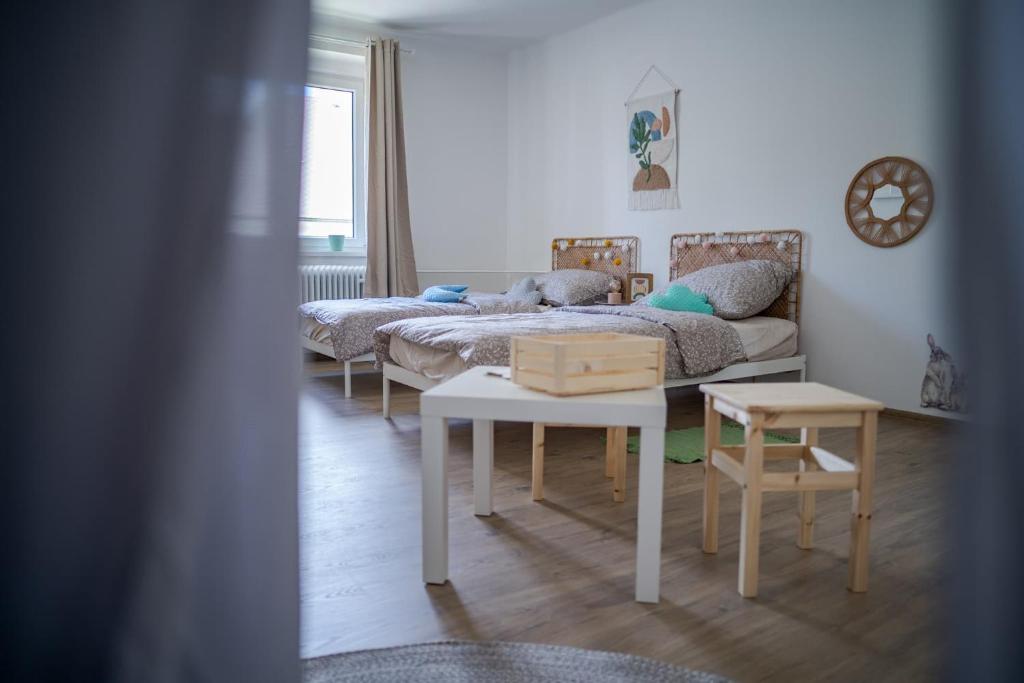 Postel nebo postele na pokoji v ubytování Velký apartmán V Pralese Šumava