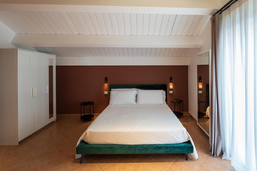 Postel nebo postele na pokoji v ubytování ArcoLoBello B&B ApartHotel