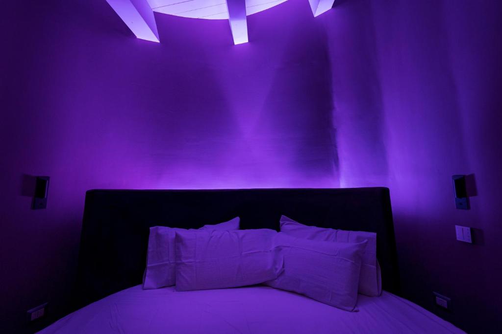 Postel nebo postele na pokoji v ubytování ArcoLoBello B&B ApartHotel