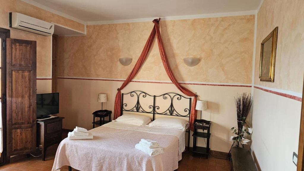 A bed or beds in a room at I Chiari