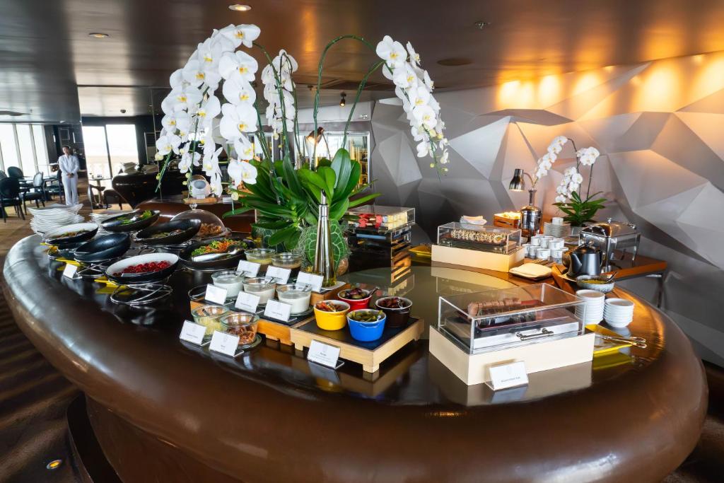 a table with food on it in a room at lebua at State Tower in Bangkok