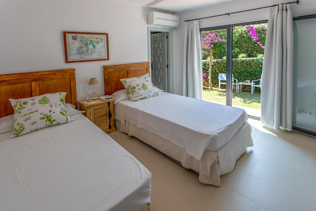 Posteľ alebo postele v izbe v ubytovaní Bonita stay B Light Piscina climatizada bbq wifi