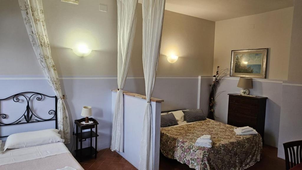 A bed or beds in a room at I Chiari