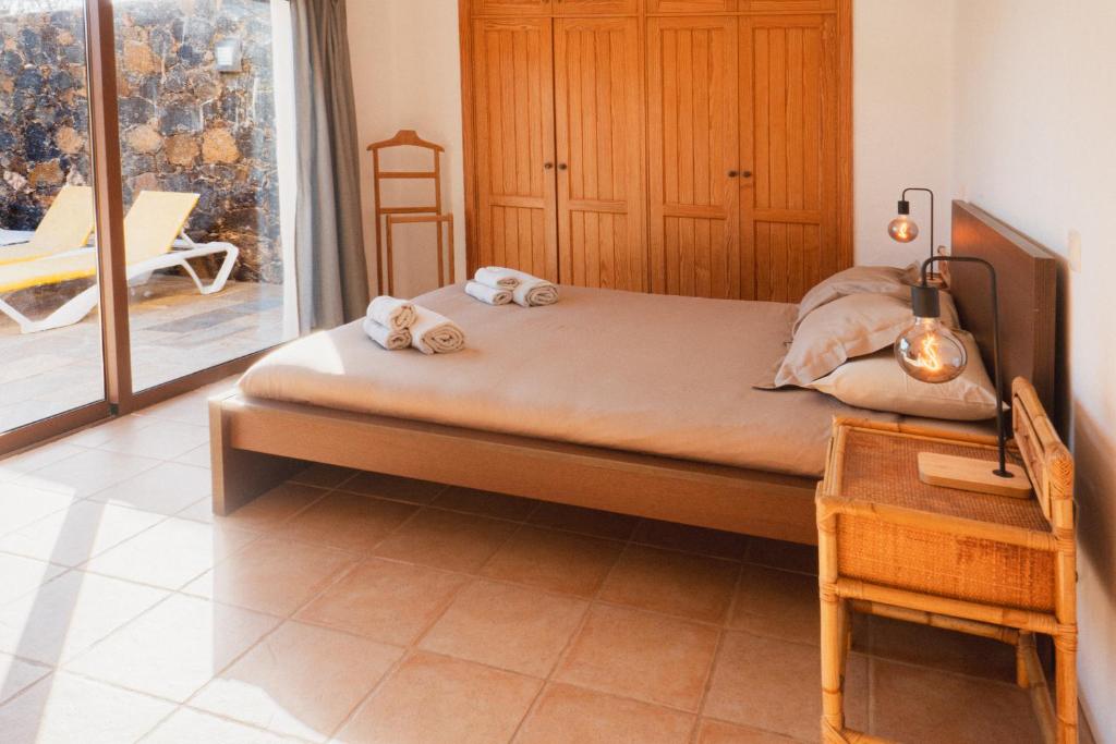 Postel nebo postele na pokoji v ubytování Villa Upupa
