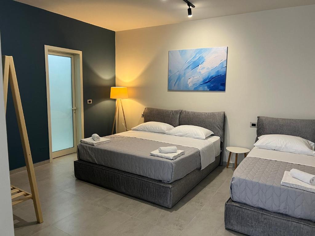 Postel nebo postele na pokoji v ubytování STAY-FIVE rooms & apartments