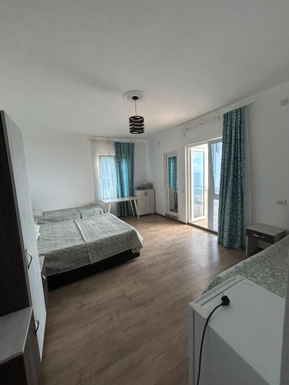 Postel nebo postele na pokoji v ubytování My House Kvariati