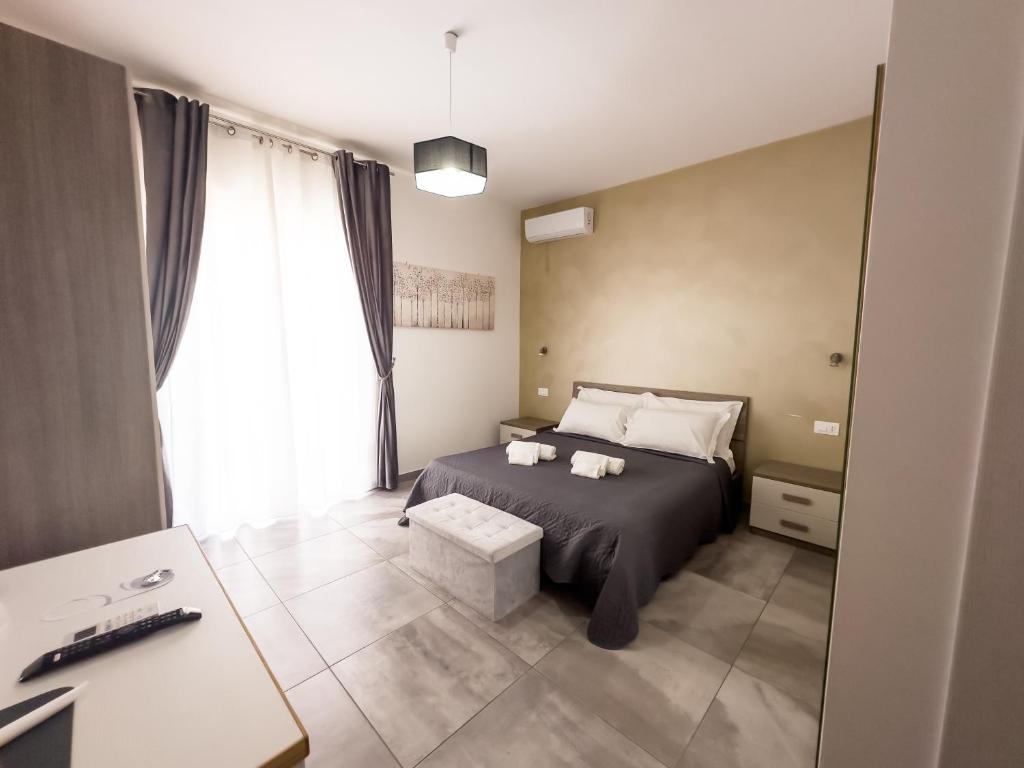 Łóżko lub łóżka w pokoju w obiekcie Four Winds B&B