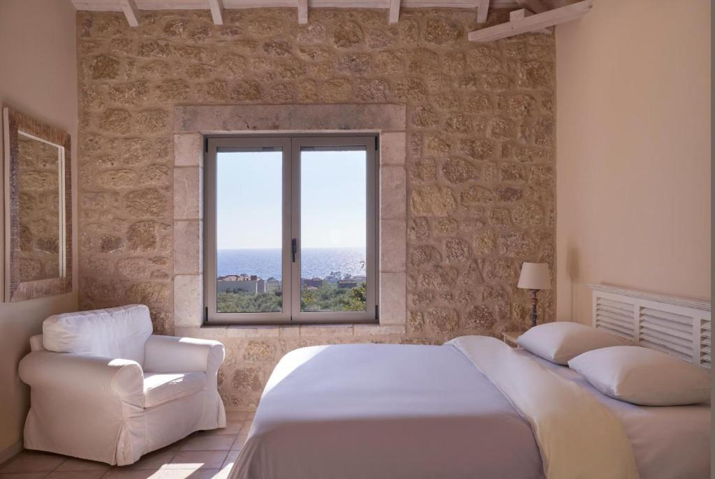 Postel nebo postele na pokoji v ubytování Riglia Villas - Villa Olive