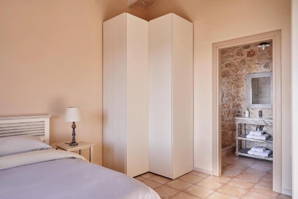 Postel nebo postele na pokoji v ubytování Riglia Villas - Villa Olive