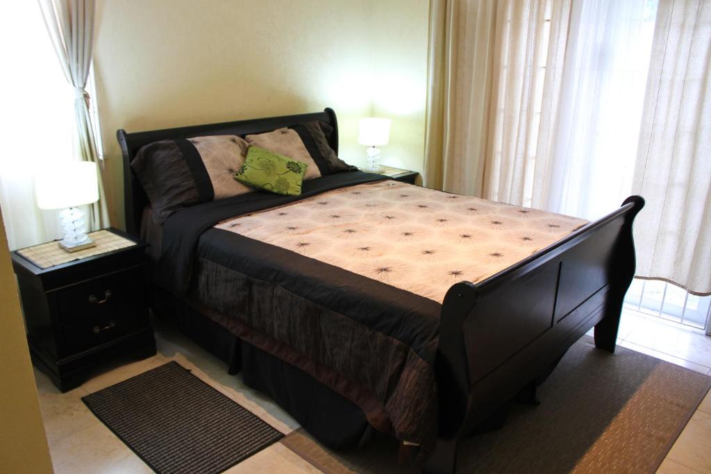 Postel nebo postele na pokoji v ubytování Eclipse Suite Guest Apartment