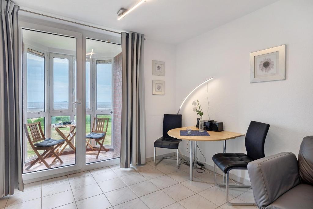 Χώρος καθιστικού στο Fewo mit tollem Meerblick auf Insel