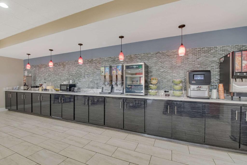 a kitchen with a long counter in a building at Quality Inn in Dalton