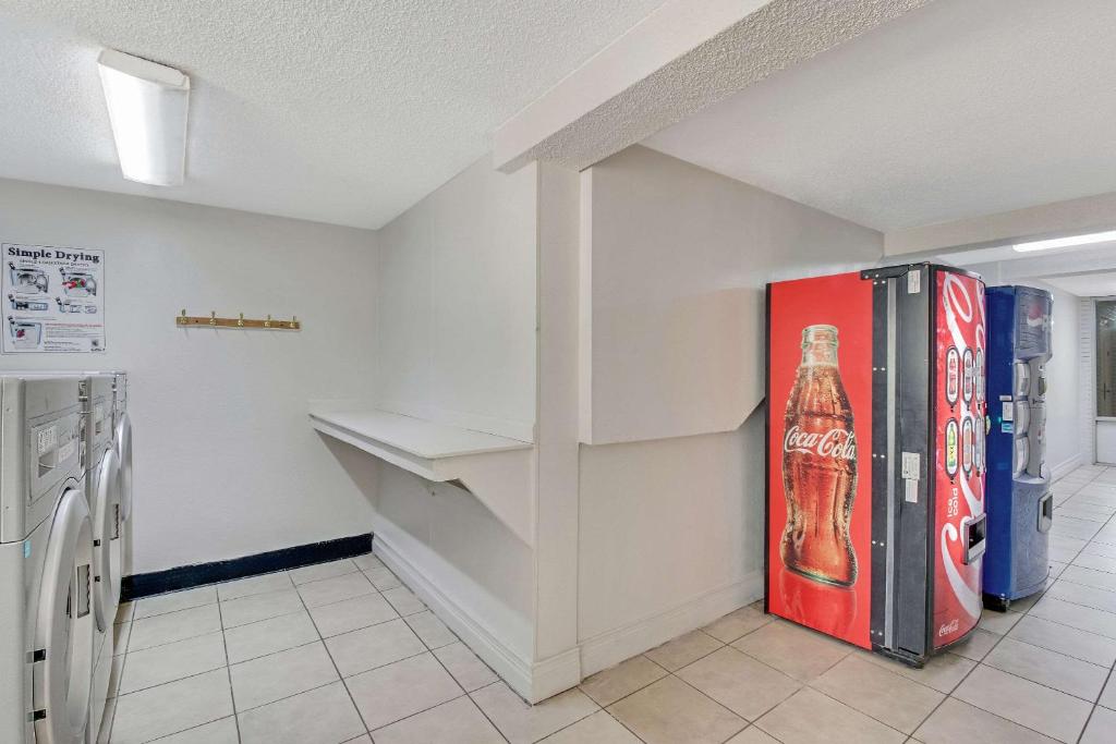 a room with a soda machine and a refrigerator at Quality Inn in Dalton