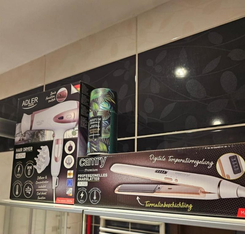 a shelf with toothbrushes and cans on it at Apartment in Zyrardow 10min to Suntago in Żyrardów