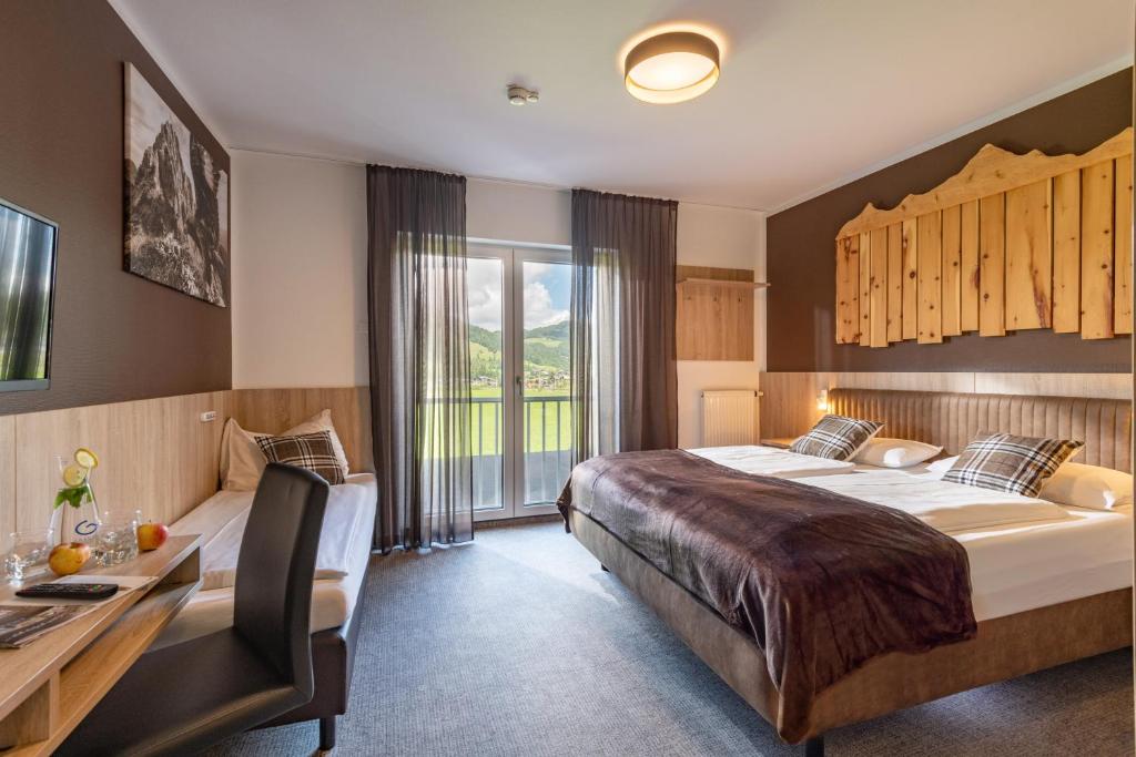 Postel nebo postele na pokoji v ubytování Fairhotel Hochfilzen B&B