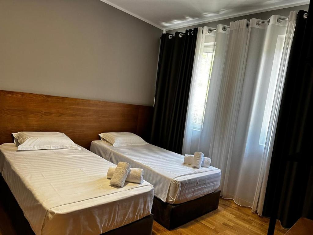 Postel nebo postele na pokoji v ubytování Hotel Rubin