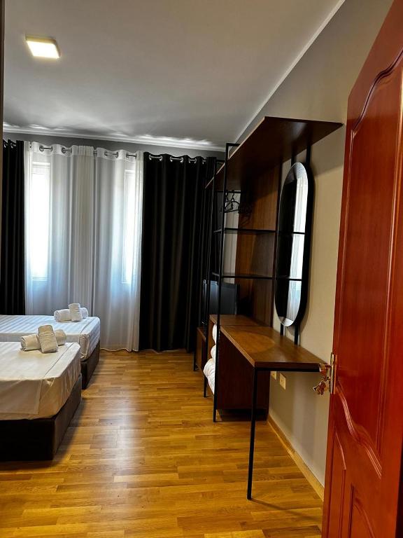 Postel nebo postele na pokoji v ubytování Hotel Rubin