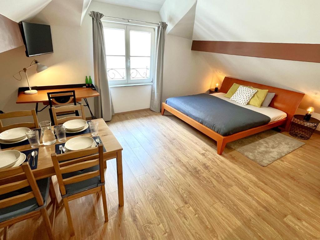 Łóżko lub łóżka w pokoju w obiekcie Apartmány Dlouhá