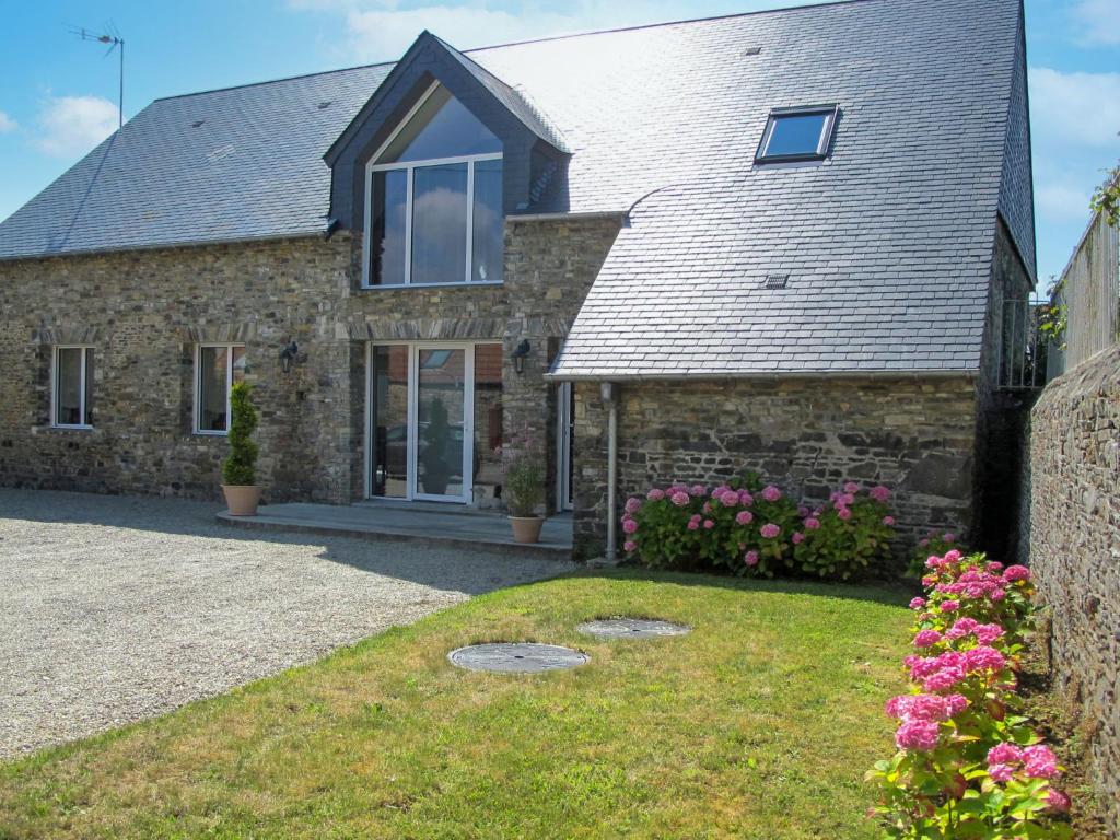 a stone house with a slate roof at Holiday Home La Lucerie by Interhome in Bretteville-sur-Ay
