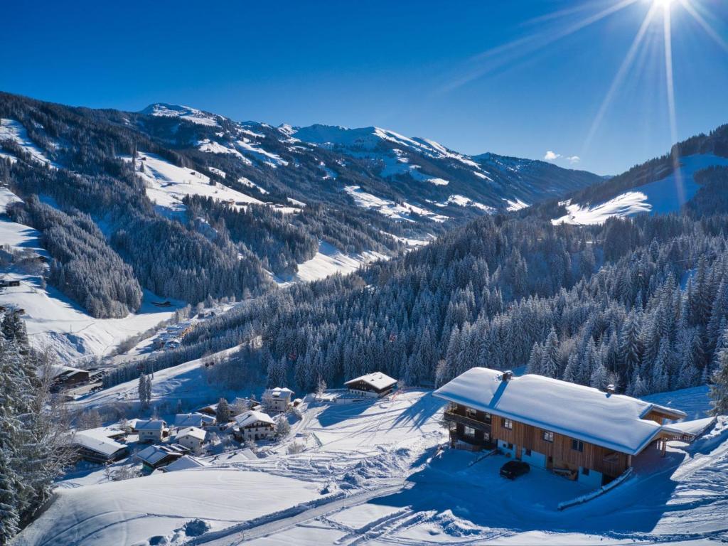 a ski lodge in the snow on a mountain at Apartment Panorama Chalet Tirol by Interhome in Auffach