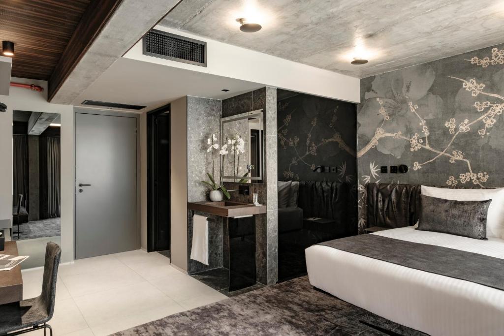 Postel nebo postele na pokoji v ubytování Fitch Hotel